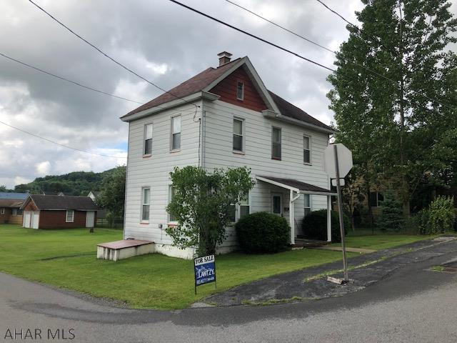 2 story aluminum sided 3 bedroom home with 2 car garage on quiet  fairly level residential corner lot.