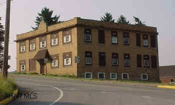 3 story, brick apartment building on Rt 36, Ashville Boro. Former schoolhouse, converted in 1980's to 7 apartments. Rental history has been good. Same ownership since 1986.  Tenants pay heat and light.