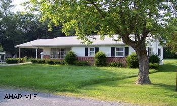 This partial brick front/aluminum sided 2 bedroom, 1.5 bath home offers one floor living and is situated close to all small downtown amenities and schools.  Livingroom has built-in entertainment center and bow window, full and walkout basement, covered back patio, carport, level yard, wood windows thruout.  Co-lister is Colleen Fix at 814.977.2075