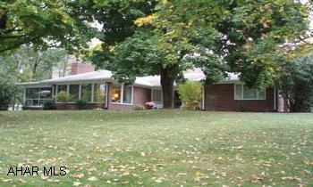 GET READY TO SPRING INTO SUMMER!   Check out this 3BR, 2.5 bath brick ranch in Meadowbrook Terrace with an attached double garage.  Enormus finished FR in basement, including a wet bar, is ideal for your next summer party.  Cozy woodburning FP in a bright & airy living room that has crown molding, charming wood shutters in most of the house.  Two BR's have built-in dressers. Bright up-dated kitchen.  Summer is hear and  the stately shade trees accent this large beautiful corner lot.  Beat the summer heat with the central air for those sultry days that are already here & the spacious screened-in porch off of the LR... for those perfect cool, quiet nights.  "Lock-in" on a new lower rate that will make your payment one of this Summers Best Buy's. Close to Bedford Schools & this home is Radon free!     Priced to move.  Call Patty Chwatek @ 814-285-0314 for your personalize tour today.