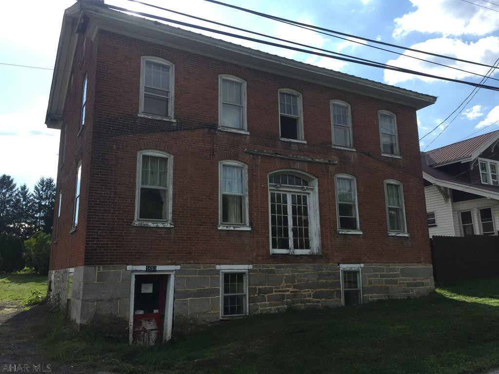 Large Colonial in a quite neighborhood.  Home needs many updates but is in a working condition.  Water supplies, drains, hot water heater and furnace are all in working condition.  Sewer line is newer.  Owner financing may be available to qualified buyers.  Property is being sold as is.  Seller of this property is also the listing agent.