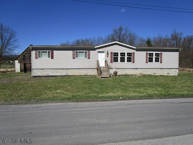 Handyman Special! This home is situated on .609 acres along with a large 28 x 24 frame shed that provides a great working area for any handyman. The home has an open floor plan and if you like a kitchen with lots of counter space, this is it. The rooms are large and there is plenty of closet space.  New carpeting, flooring and drywall repair is required throughout and property is being sold "As is, Where is."