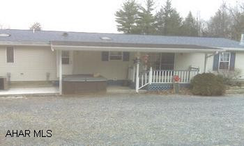 Very nice one story modular home with wood burning fireplace in family room.  Beautiful views from covered rear porch.  Two car garage has heated workshop, second floor loft,  and high door for RV or boat storage.  Tractor stays with property. Very nice one story modular home with wood burning fireplace in family room.  Beautiful views from covered rear porch.  Two car garage has heated workshop, second floor loft, and high door at rear for RV or boat storage.  Tractor is included in sale.  Directions:  From Rt. 866, turn onto Clover Creek Road and go 5 miles to Eastep Road on the right.  Property is third house on the left.