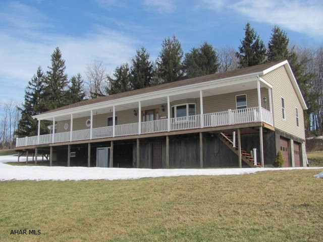Carrolltown- Great view from the large front porch of this 4BR, 2+ bath ranch home on over 3 acres. Oak kitchen. Outdoor HW wood furnace w/ oil backup. Propane fireplace, sunroom with hot tub. 2-2 car garages
