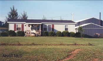 1993 24X44 three bedroom, two full baths doublewide on 1 Acre.  40X60 insulated garage