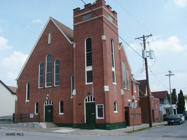 *  Allows use as art / technology center.  First level has reinforced floor for heavy equipment.  Includes 2 story attached dwelling.  Church is on second level.  1st level has recently been a wood shop.  Building has full basement.  Attached dwelling is 50% remodeled.  Side fenced paved parking lot.  Owner may consider Rent with Option to Buy.