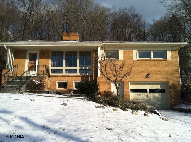 What a great starter home, especially for people who crave a beautiful, well-maintained, in-ground heated 36' by 16' pool!  There are 2 beautiful fireplaces - in the living and family rooms.  Dining bar and dining room overlook the patio and pool.  One car heated oversized integral garage.  Hardwood floors under all carpeting.  This cozy house is very clean and recently painted.  Move-in ready.  Patio cover included as well as working bench area in garage.