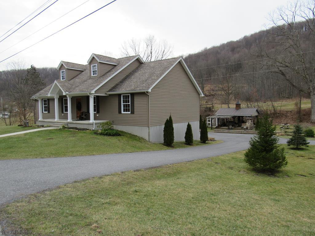 You will love this Country Setting & you will be in awe when you step inside this meticulously maintained move in ready ranch home built in 2012 with it's open floor plan, and wonderful features situated on 1.37 acres.The home's foundation was built with a Superior Wall system,it also comes with a back up generator & its hook up.It has a 16.9 x 21'9 Pavilion with outdoor lighting & stone fireplace for entertaining friends & family.Adjacent to the Pavilion is the 7'x x 11'4 Green House for those who have a green thumb.The 24'4 x 42'8 Out Building can be used for all your toys and still have room for a work area and storage.The house lower level could be an in-law suite or could be rented for the ski season at Blue Knob. Schedule your showing now!