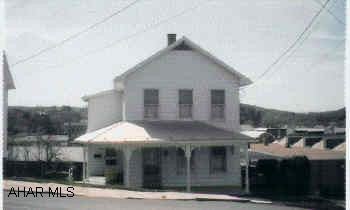 2-Story aluminum sided, 3BR/ 1 1/2 BA, covered patio, in town.