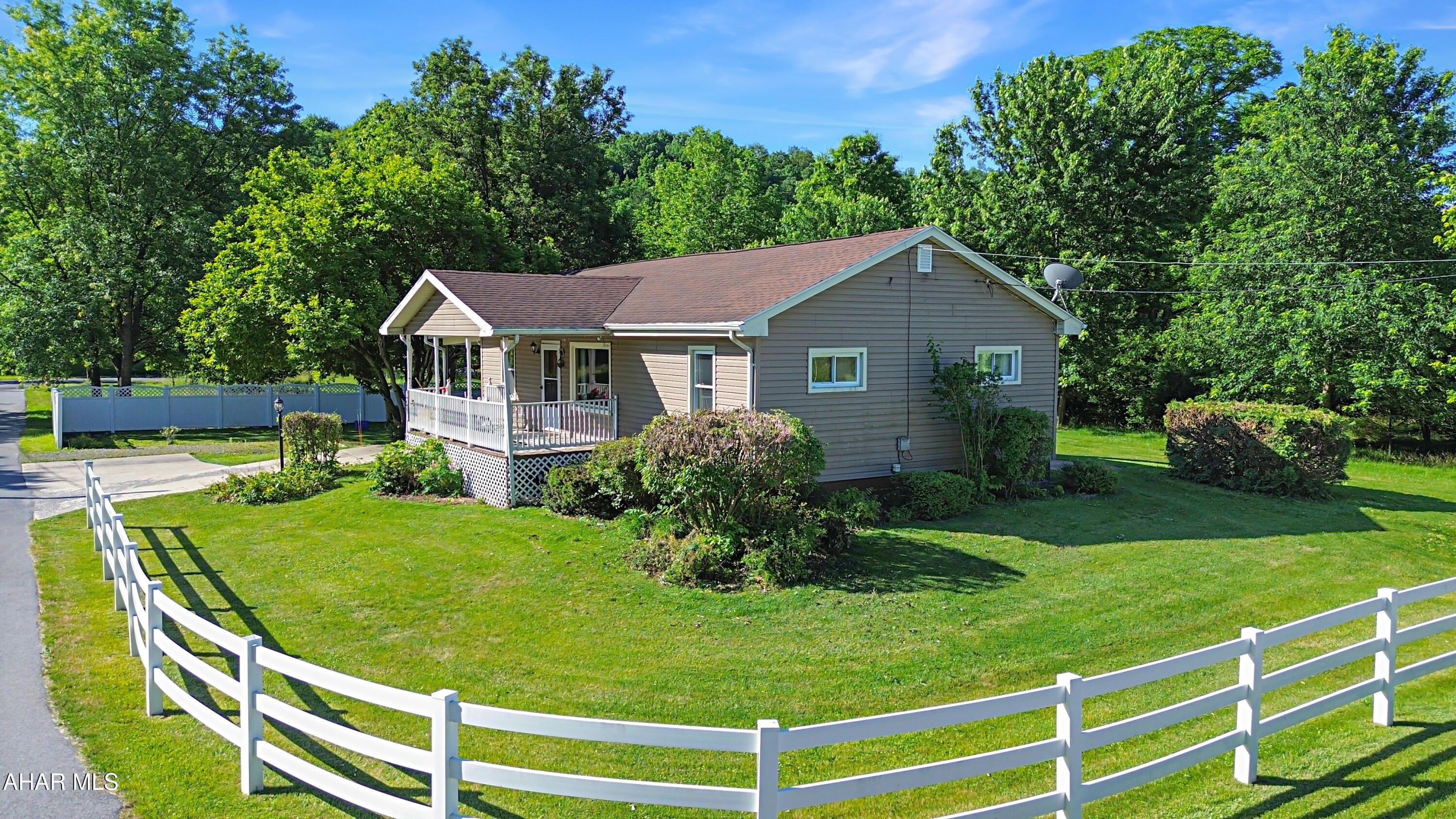 Welcome to 5711 Maryland Avenue in Altoona, a beautifully maintained ranch-style home nestled on a private corner lot and surrounded by city-owned land, offering a rare sense of privacy and seclusion. The main level features a spacious living and dining room combination, a well-appointed kitchen with elegant quartz countertops, three generously sized bedrooms, and an updated full bathroom. Gorgeous hardwood floors flow throughout most of the first floor, adding warmth and character to the home. The unfinished basement provides excellent storage space and endless potential for future finishing, while also housing the laundry area and mechanical systems. Recent updates include a newer furnace and central air conditioning system for added comfort and peace of mind. Outside, you'll enjoy a covered front porch, rear deck, carport, expansive yard, two storage sheds, and plenty of outdoor space. This move-in-ready property offers the perfect blend of comfort, privacy, and potential. Call today for more information or to schedule your private tour!
