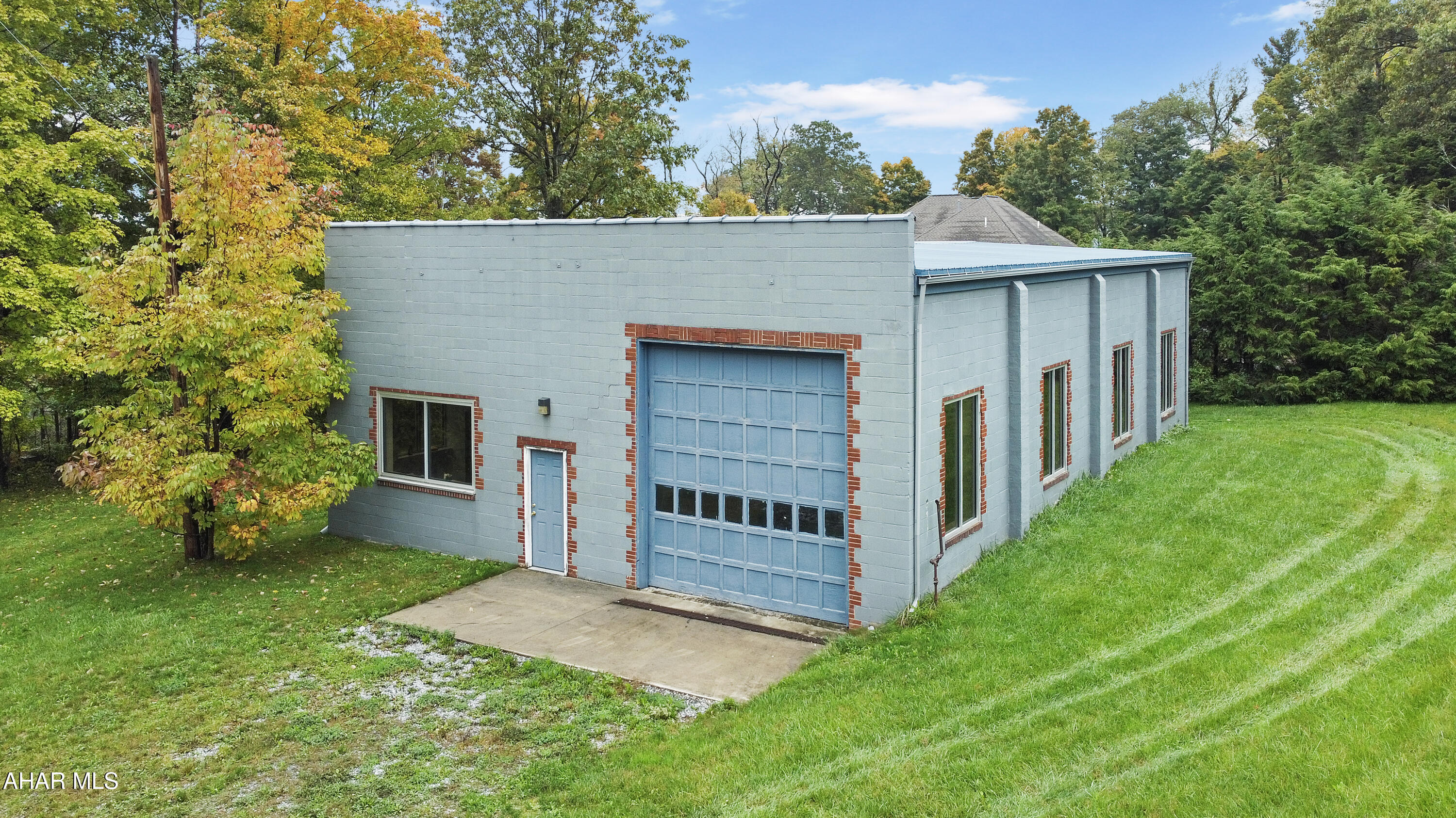 Don't miss this exceptional opportunity to own a prime commercial garage located in the heart of Cresson, right off Admiral Peary Highway! This spacious approximately 2,300 square foot facility features two expansive 14-foot garage doors, making it ideal for automotive, construction, warehousing, or virtually any business venture you envision. Recently renovated, this garage boasts a host of modern updates, including new windows, insulation, an office space, a full bathroom, updated lighting, electric, & a durable metal roof. With its versatile layout & ample space, this property is ready to accommodate your business needs. Currently, the only heating source is electric baseboard in the office area, but natural gas is readily available for easy installation, providing an opportunity for enhanced efficiency. Don't wait—call today for more information and take the first step towards securing this incredible commercial property! The neighboring house at 614 Laurel Avenue is also for sale, possible package deal available.