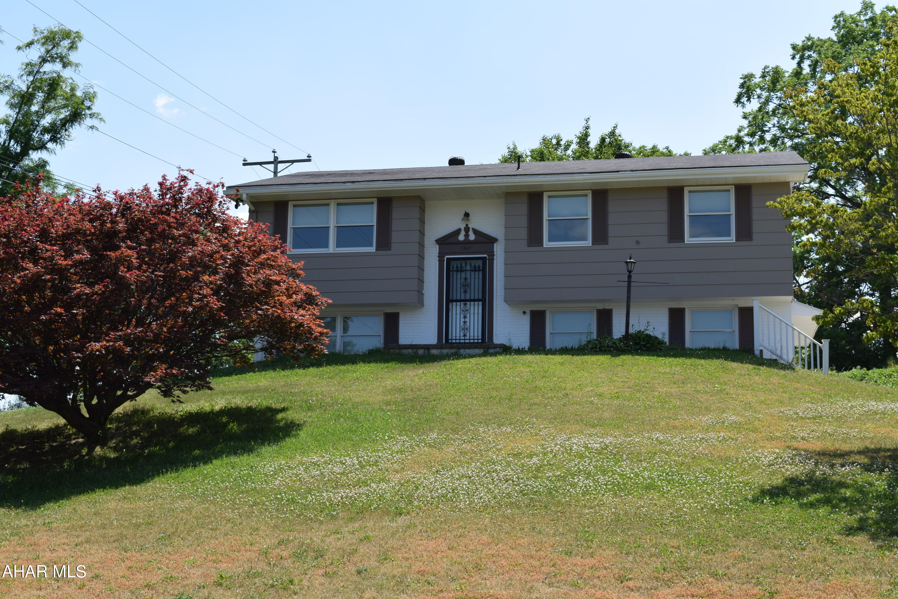 Move in ready completely remodeled throughout  3 bedroom 2 bath home includes all new windows, flooring, baths and  kitchen appliances. Outside enjoy the views on the new composite deck with vinyl railings overlooking a large yard (2 separate parcels included). One car integral garage and a large driveway for off street parking.