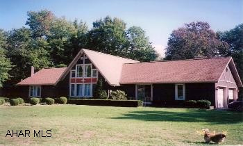 1.5 Story home on 8.8 beautiful wooded acres. Secluded and peaceful. Pavilion for those family picnics. 2BR/1BA, loft overlooking large living room.