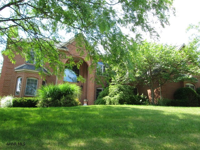 ELMWOOD/HOLLIDAYSBURG - One of a kind, custom built, all brick beauty. This custom home features a double stair case to 2nd floor. The total of 6 bedrooms, 5 baths and one 1/2 bath makes this the perfect house for guests. The island kitchen features granite tops and top of the line cabinets. First floor is all hardwood floors. The oversized, 3 car garage is a great size. Nothing compares to this construction and location at this price!