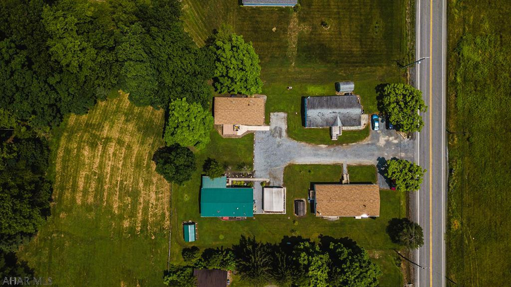 Beautiful 3 bedroom, 2 bath Mobile Home. Very nice. Country feel. There are currently 3 lots that are currently rented out for $305.000 each. $915.00 income coming in every month. Carport is 18x20. Shed 10x14.
