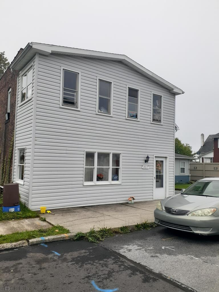 Nice brick and vinyl duplex. 1st floor has laundry area and access to rear porch. 2nd floor has added space with an enclosed porch and is currently occupied. There is space in rear for off-street parking. Great investment property.