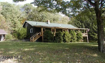 1 1/2 Story Log home on 23.5 acres 1 1/2 Story Log home on 23.5 acres.  Wood stove.  I-99 to Tipton/Grazierville exit, left at light, right at Degols, lane on left across from CMA Church.