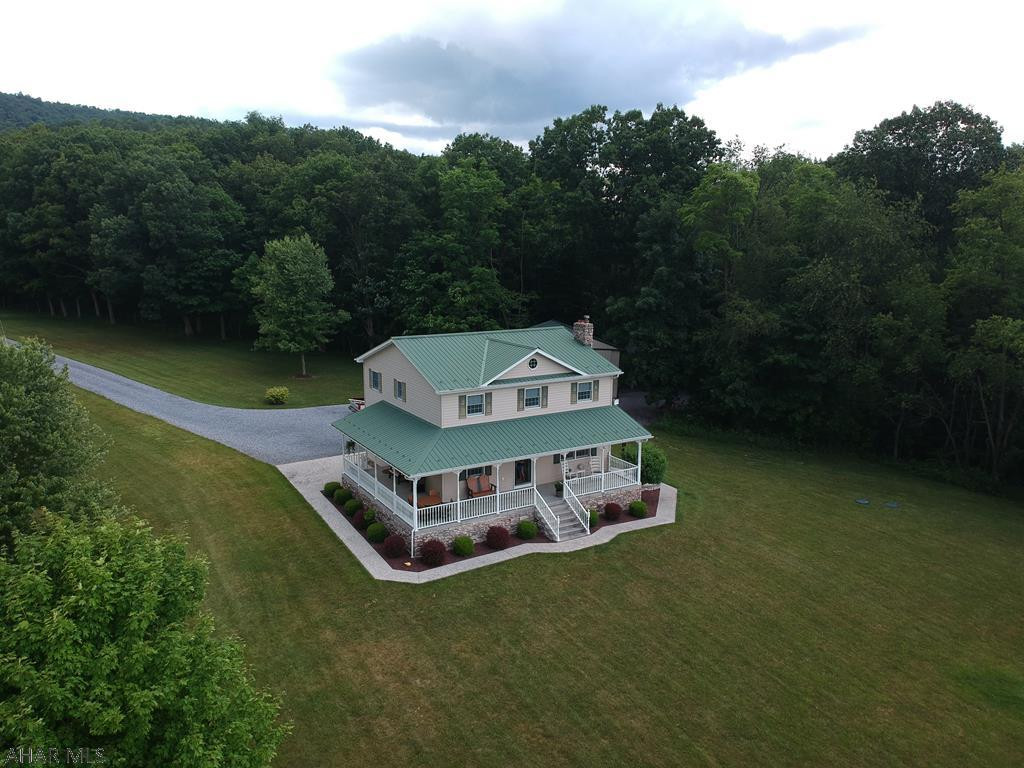 Enjoy the stunning wrapped front porch of this meticulous 3 bedroom 3.5 bath 2 story on 10 acres!! Very private setting this country home offers priceless views of the country and mountains!  Large kitchen with plenty of cabinetry including refrigerator and range!  3 large sheds provide plenty of storage.  Finished basement and central air. Don't miss this great opportunity for rural living! MOTIVATED SELLERS!!!