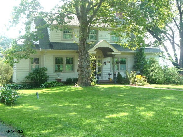 Lovely Dutch Colonial 1.5 private, beautifully landscaped acres convenient to town. This tastefully decorated home features LR w/ fireplace, formal DR w/ French doors - 2 corner cupboards, fam. room w/wet bar, den/sunroom, a grand foyer and a 1st floor bath. It also comes w/ a cheery eat-in kitchen/pantry cupboards, appliances and laundry. The 2nd floor offers a master suite w/ bath and walk-in closet, two add'l bedrooms and another full BA. Details throughout include hardwood floors downstairs and some crown moulding. Outside a covered porch/veranda overlooks a flagstone patio w/ fireplace and fish pond. Mountain views, a fenced in backyard, an in-ground pool, furnished guest house (possible B&B-home office, in-law qtrs.) det/garage, stone pillared entry and expansive paved parking area.
