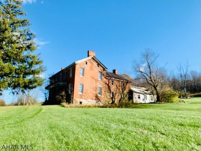 Built in the 1800s, this two-story brick home on 22 +/- acres is the perfect restoration project for someone that has the passion and the vision or someone that is looking to build from the ground up. The property is close to downtown Bedford so if you enjoy antiquing, shopping and dining you don't have far to go. If you love year-round outdoor activities, Shawnee lake, Blue Knob Ski Resort and the Omni Bedford Springs Resort are only a short distance away. Come check out the possibilities!  Well and Septic is present but unknown if they work. (Use CAUTION when entering the house and all rooms). Taxes will be prorated upon subdivision approval. Property is being sold As-IS.