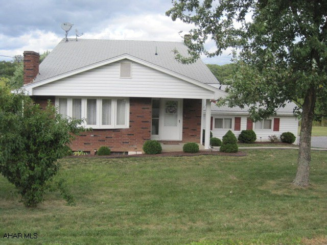 Custom built 4 bedroom!  Original owners and pride of ownership abounds! Hardwood throughout. Updated kitchen with newer appliances! Newer mechanics. Large flat lot in quiet location!