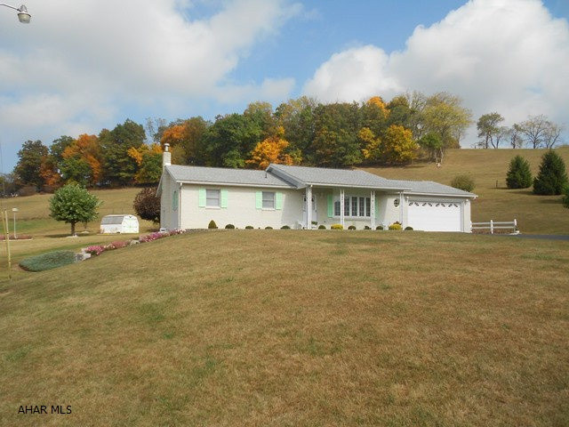 Views, views, views with this brick ranch home and 2 car attached garage. Three bedrooms, 2 full baths upstairs. Finished basement w/ gas fireplace. 1/2 bath in basement. Lovely landscaped yard, small shed, paved driveway all of this setting on 12.6 acres. Beautiful!