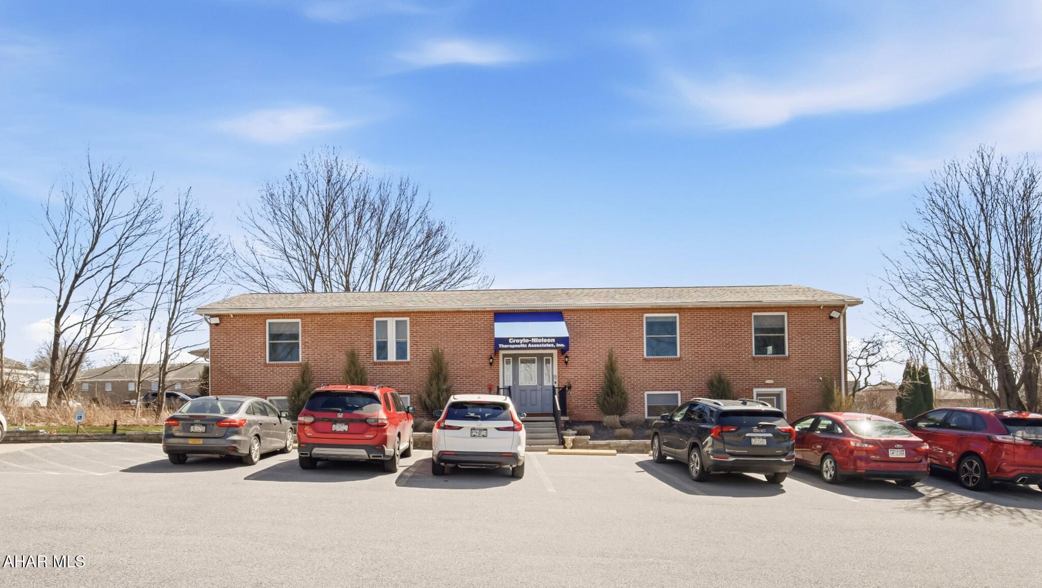With the previous business now relocated, here's your chance to benefit from their efforts and elevate your own. This fully remodeled and updated brick office building in Richland Twp. features central air, ADA access, 14 offices, a reception area, a spacious conference room, three bathrooms (including one ADA-compliant), a kitchenette, and 17 parking spaces. Upgrades include all-new wiring (optimized for high-speed internet), furnace, flooring, windows, interior and exterior lighting, front and back stairs, and gutters. The outdoor space has also been improved with tree trimming and removals for better accessibility.