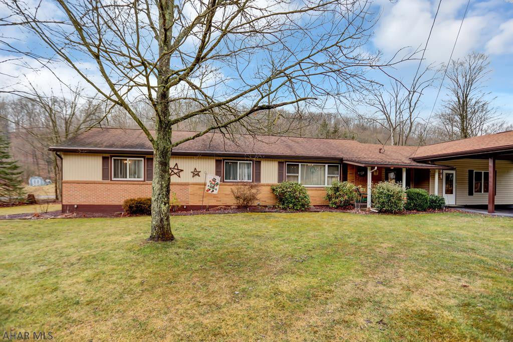 GREAT LOCATION!!! This 3 bedroom, 2 bath house is a great find! Inside features beautiful hardwood floors, spacious kitchen with lots of cabinet and counter space, and a large master bedroom. The finished basement is perfect to spend time with family and friends. There is also an In-Law suite with a full bathroom. Outside you'll enjoy relaxing summer evenings on the back deck, complete with a hot tub. There is also a nice size yard, large shed, off street parking and carport. This house is a MUST SEE!!!