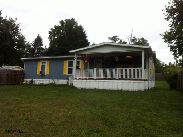 3 Bedroom, 2 bath 26x48, 1987 Doublewide on nice fenced owned lot with 26x26 attached 2 car garage. Newer hot water tank, new shower/tub unit. Newer flooring throughout, laminate, tile and carpeting. Freshly painted exterior.