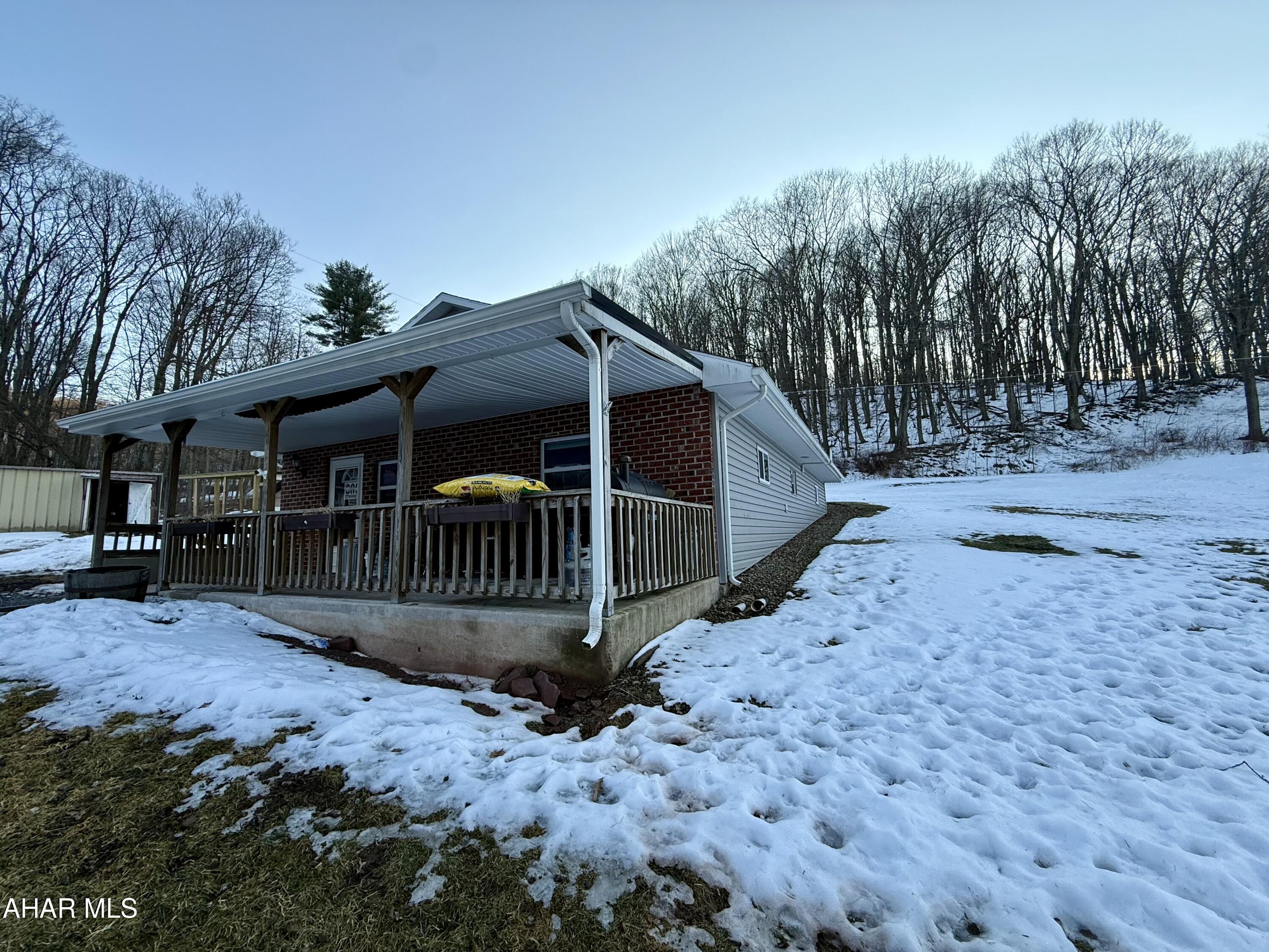 Charming one-story home situated on 1.9 acres with a 1 car detached garage.

 This 2-bedroom, 1-bath property offers comfortable single-level living with timeless character throughout, including beautiful hardwood trim, solid wood doors, brick accents, and deep windowsills. 

The spacious kitchen features a breakfast bar, stainless steel appliances, and even a built-in drink cooler perfect for entertaining. Recent updates include new LVT flooring in the living room. Along with New kitchen cabinets.  Kitchen and bathroom have ceramic title for a clean, modern touch.

Enjoy the outdoors with a front porch, Scenic views and an all-around and peaceful setting.