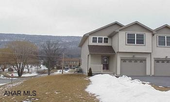 Terrific townhouse across from Scotch Valley Country Club.  Includes 1-year membership to Club!  3BR, 2.5 BA Hardwood and ceramic floors.  Cherry kitchen.   Bright corner unit on large lot.  Nice open floor plan.  Great views!  Hardwood floor in great room.  Porcelain tile in kitchen and baths.  Includes 1-year membership to Scotch Valley Country Club!