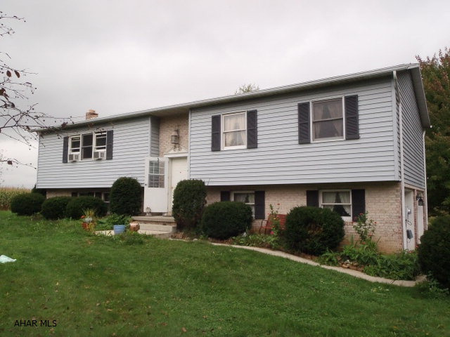 Nice bilevel on 1.195 acre level property.  Lovely country setting across from orchard.  Home has lots of potential - in need of some repairs.  Owner will accept offer with VA/FHA financing, but buyer must complete any required repairs.  Garage with partially finished attached apartment included in sale. All offers on property must be received by 9/30/11 to be considered.