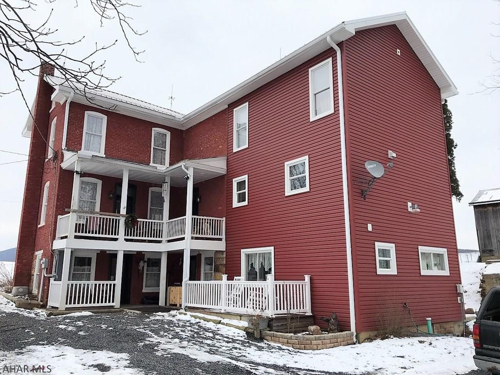 This absolutely scenic farm is tucked away in its rolling fields with peaceful mountain views. Resting on 125.69 acres with 80 tillable, 14 fenced pasture and the remainder wooded, a tranquil stream and spring fed pond. The recently updated and remodeled from top to bottom farm house has a LR, FR w/ fireplace, DR open to the kit and sun porch, kit with granite counters and island, and a 1/2 bath on the main level. Second level features a m. bed with walk-in closet, two additional bedrooms, laundry room and 2-full baths. Full finished basement with a rec room, game room, office and another full bath. Basement is walk-out to ground level. Heat pumps with central air, propane forced air and a rice coal burner. Huge 73' x 83' bank barn, machine shed, summer cottage and other outbuildings.