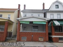 This is a Fannie Mae Homepath.com property. This is a large 2.5 story home in Altoona. The rear features a 2 car detached garaged and fenced yard. The front has an appealing front porch. The main floor has a living room, dining room, kitchen with laundry hookups and a closet with commode. The second floor has a full bath, two bedrooms and a captive room. The basement is a walk up that is currently used for storage, but could be used as a third bedroom with some custom touches. Make this house your home