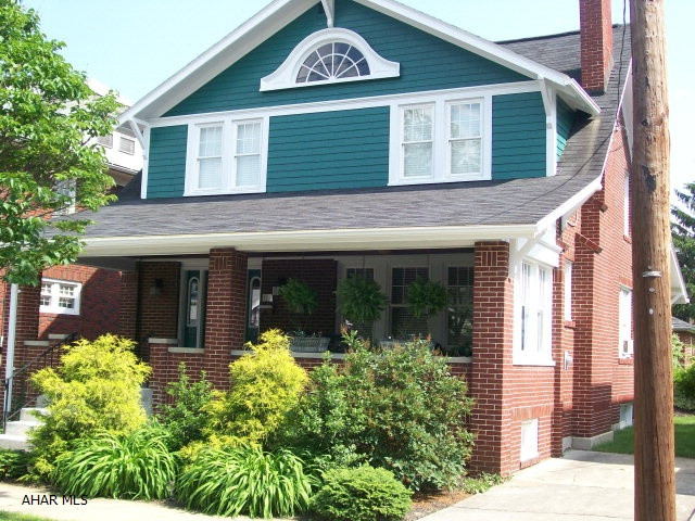 This charming 1920's era bungalow was comp;ete;y updated. New custom kitchen with granite countertops, hardwood floors, new baths, roof, windows, plumbing, furnace, hot water tank, gas logs, brick patio with awning. New concrete steps and front walkway.