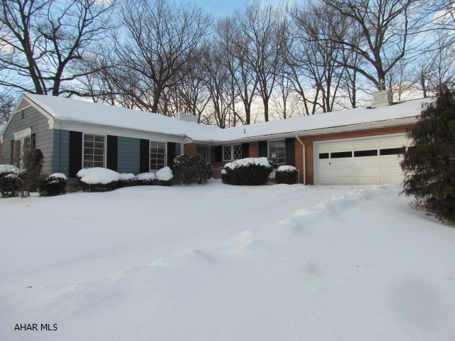Well maintained home in the Westmont School District, boasts hardwood floors, living room with a fireplace, Knotty Pine Kitchen Cabinets in the large Eat in Kitchen, Master bathroom,  2 car attached garage and a large backyard with a deck. plenty of storage space in the basement, which has a bar and painted floors. Don't miss this opportunity. Nice setting with mature trees.