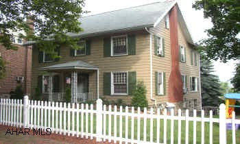 THIS HOME WAS COMPLETELY REMODELED BUT ALL THE CHARM REMAINS.  HARDWOOD FLOORS, 2 FIREPLACES, SPACIOUS ROOMS WITH HIGH CEILINGS.  BEAUTIFUL MASTER SUITE.  TOTALLY FINISHED 3RD FLOOR.