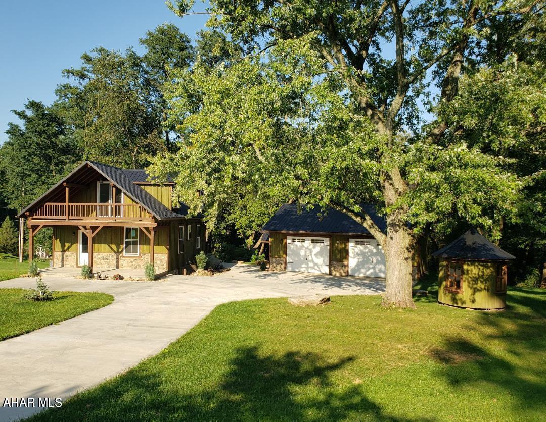 Home TOTALLY transformed inside & out. 3.365 Acres w/woods & trails. Overlook Central Dragon's Football Field from one balcony. New Kitchen, Bath, finished basement, plumbing, walls, wiring, siding, heat pump w/central air, porches, balconies, landscaping, concrete drive, roof dormers, 24x32 2+ car garage, and circular shed. J-628
