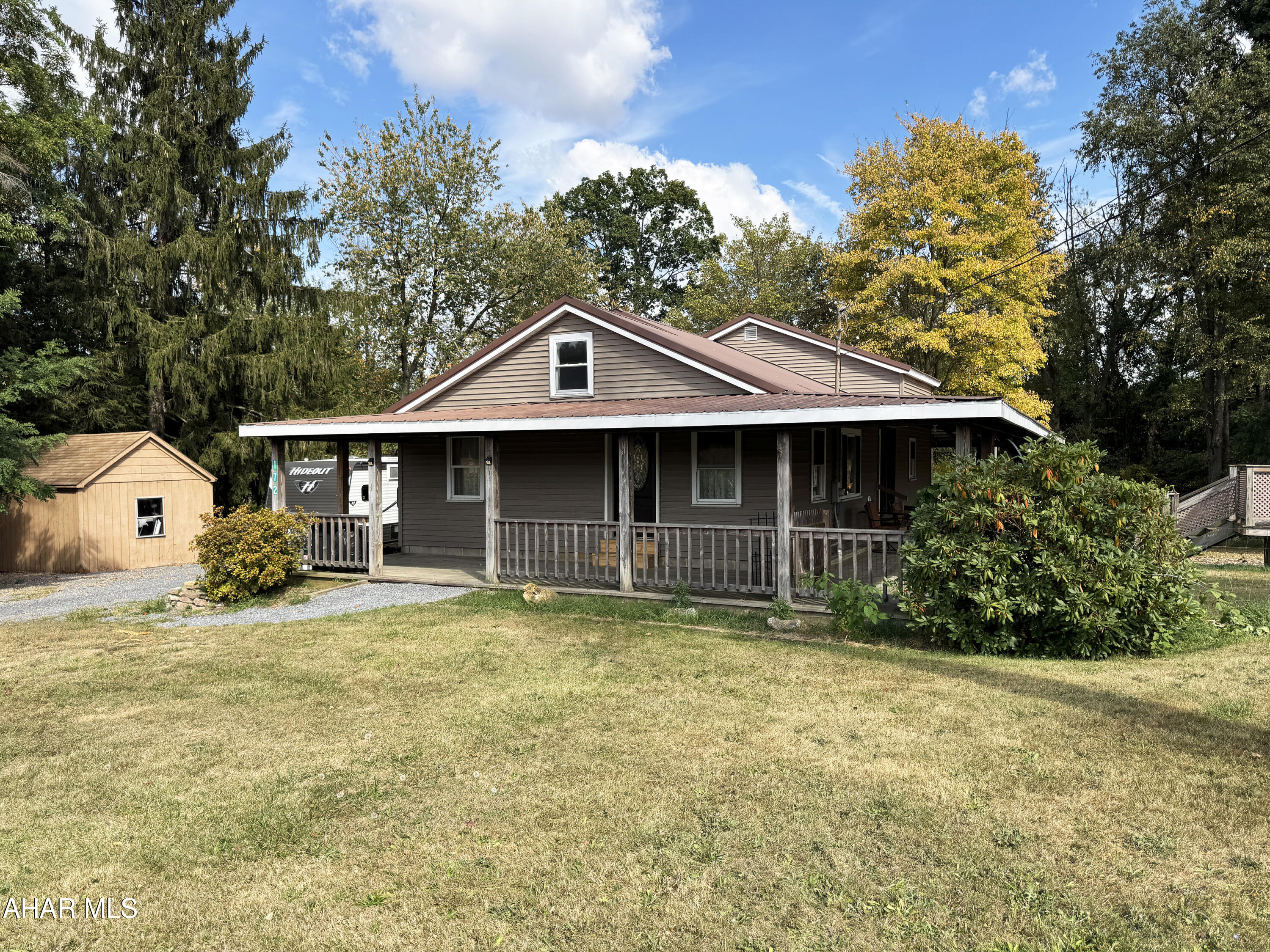 This four bedroom, 2 bathroom home with granite countertops, vaulted ceiling, spectacular wrap around porch, and 4.10 acres is calling your name. Nestled within the beautiful countryside of Roaring Spring and the Spring Cove School District, this updated and improved home provides more than enough space to live and grow. 172 Dick School House Road is in proximity to local shopping, dining, and entertainment. A quick hop onto Route 99 will provide further amenities in Altoona and State College or head over to historical Bedford via Route 36. Whether you are looking for a quiet place of relaxation and pretty views, hosting friends and family both indoors and outdoors, or trying your hand at homesteading, with some finishing touches, this home is your ''Home Sweet Home.''