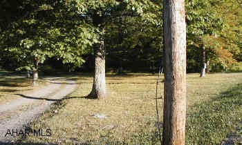 Nice level piece of ground across from BelAir Estates. 950+- of road frontage. Great site for warehouse, storage, shed, auto sales, etc... VACANT LAND           Nice level piece of ground with lots of road frontage. Sewage is available but not currently conected on site.