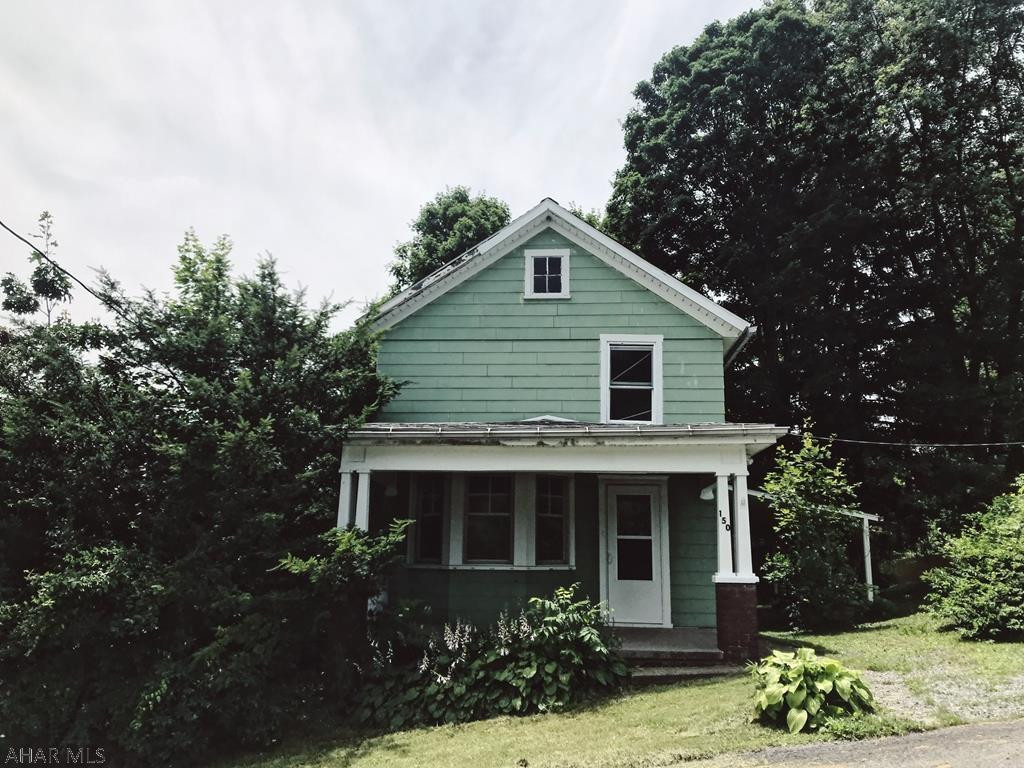 This cute home has all new flooring, new paint and is in need of a new owner! Located on almost 3/4 of an acre right outside of downtown Tyrone. Massive windows in the living room let in so much natural light. Large kitchen with washer & dryer hook ups.  Home might be under 150 Arch Street Tyrone.