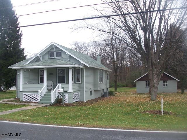 Lovely 2 Bedroom Ranch on 1.15 acres. Beautiful Flat Wooded Lot, 2 car Detached Garage. Home Totally Remolded, New Kitchen, Bathroom, Flooring, Furnace, Central Air, and Electric.