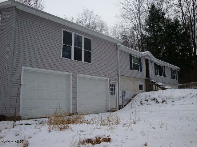 NO FURNACE and NO HOT WATER HEATER. Lots of potential, doublewide on a full foundation, integral garage with additional living space above it, master bedroom with walk-in closet and full bath with whirlpool tub, oak kitchen, Minimum earnest money deposit must be $1000 or 2% of contract price, whichever is great, to be paid by cashiers check or certified funds payable to Colony Realty Group, LTD.  There are Homeowners Association fees of $413.10 for 2011, billed in 3 installments.