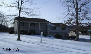TRI-LEVEL HOME WITH 2 CAR INTEGRAL GARAGE. BEAUTIFUL PRIVATE SETTING FOR THIS LOVELY 4 BEDROOM & OFFICE. 3 LEVEL HOME. BEAUTIFUL OAK THROUGHOUT. HUGE LR, LARGE EAT-IN KITCHEN, LOVELY LOT. ELEC. HEAT PUMP W/OIL BACKUP.