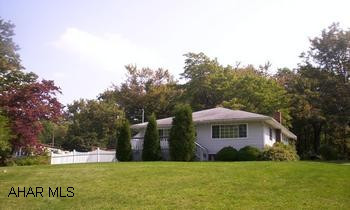 Vinyl sided one story home on 1.3 acres of ground.  Beautiful home on great lot.  2 car detached garage, carport, microwave,dishwasher, finished basement, hardwood floors, central a/c and much more.