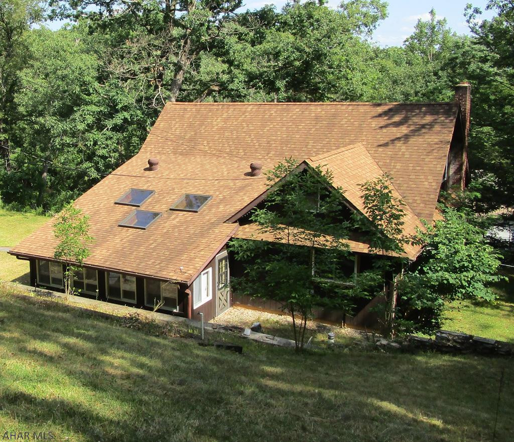 Don't pass this house by!!! Spacious 3 bedroom home with one bath. Large bedrooms. Den/Office. Heated season room with skylights. Living room with stone wall fireplace. Bay window in the dining room. Partial finished basement with family room and laundry room with slob sink. 1 car integral garage.  1.75 acres with in-ground pool with pool house.