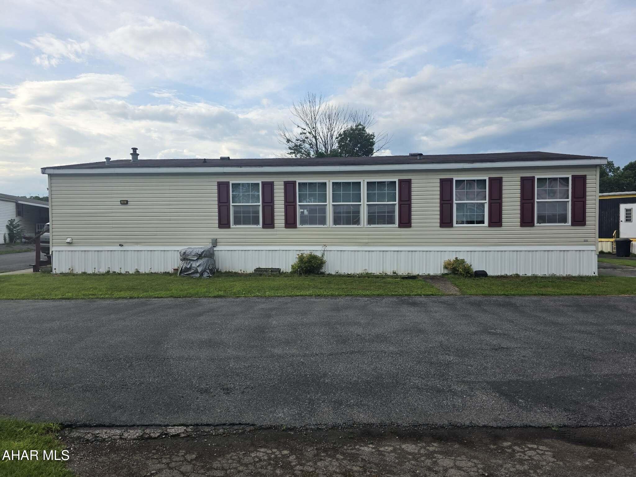 Come check out this move in ready, very spacious double-wide in the 55+ Eldorado Mobile Home Court. Three large bedrooms and two full bathrooms, and this home has endless storage. Large eat-in kitchen with island and all appliances are included! Room to park 2 vehicles, including one being under a carport. Beautiful deck to enjoy the outisde, along with a big shed for additional storage. Close to shopping and restaurants. Lot rent is $710 per month. Includes trash removal & common road maintenance.