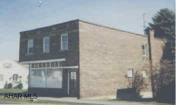 First floor recently a baton studio, 2nd fl apt. Variance required. 4-car detached garage.