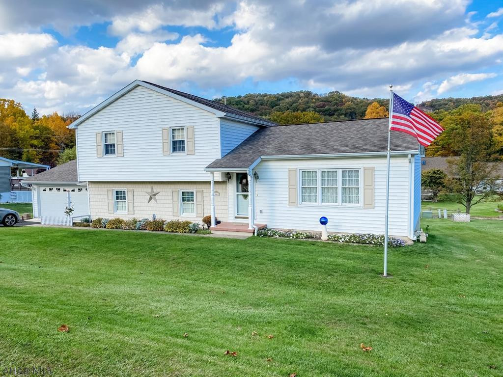 Meticulously maintained split-level with finished basement; central vac; modern kitchen with granite counter top and touchless faucet; updated bathroom with ADA compliant walk-in shower with grab bars; two power exhaust fans on roof; new hot water heater; attached heated two car garage with storage; heated mudroom and basement; LED lights throughout