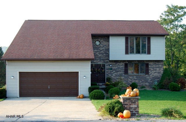 You can only own so many homes and these homeowners have two other residences so are willing to sell this home below market value for this area.  In a great neighborhood. This home is located in the Hallowdale Estates and is move in ready. All the rooms are of significant size and the square footage of the home is approximately 2400 feet which includes all three levels.The sunroom is absolutely incredible along with the view.  Third garage stall in back is handy location for lawn mower and additional storage.  Entire house has just been painted with O-Voc paint which contains no chemicals. The second bedroom has been used as an office.  The desk in that room also can stay. All utilities are underground.New carpet has just been layed on the steps going to the second floor.
